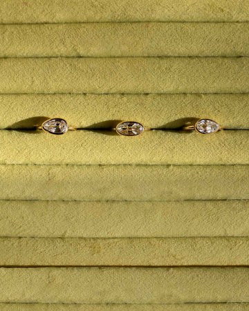 Closeup details of the custom jewelry displays within the Mociun Williamsburg Brooklyn Showroom interior, featuring autumnal colors, warm walnut finishes and furnishings from Bower Studios.