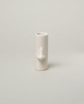 Bonam Kim White Nose Pillar Vase on light color background.