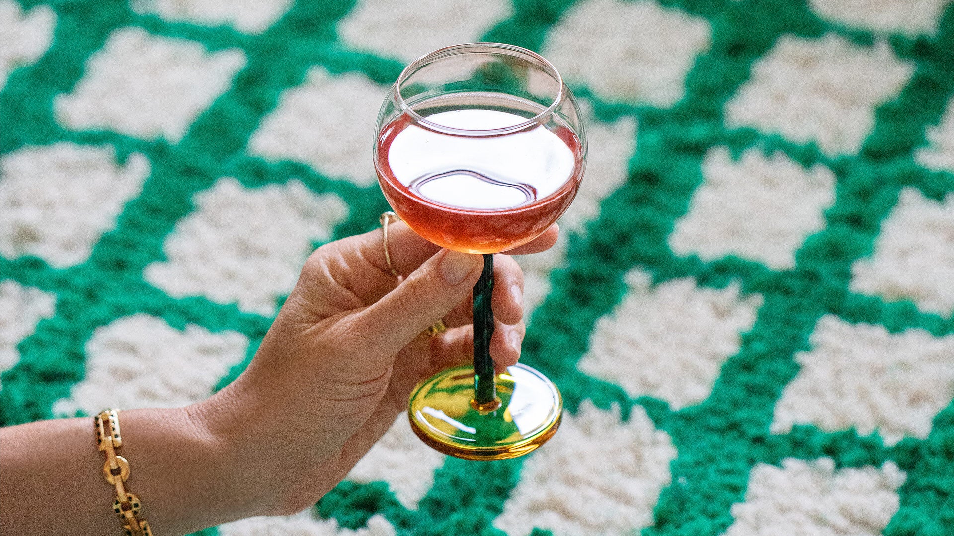 Styled image of the Sophie Lou Jacobsen Evergreen & Honey Bilboquet Wine Glass.