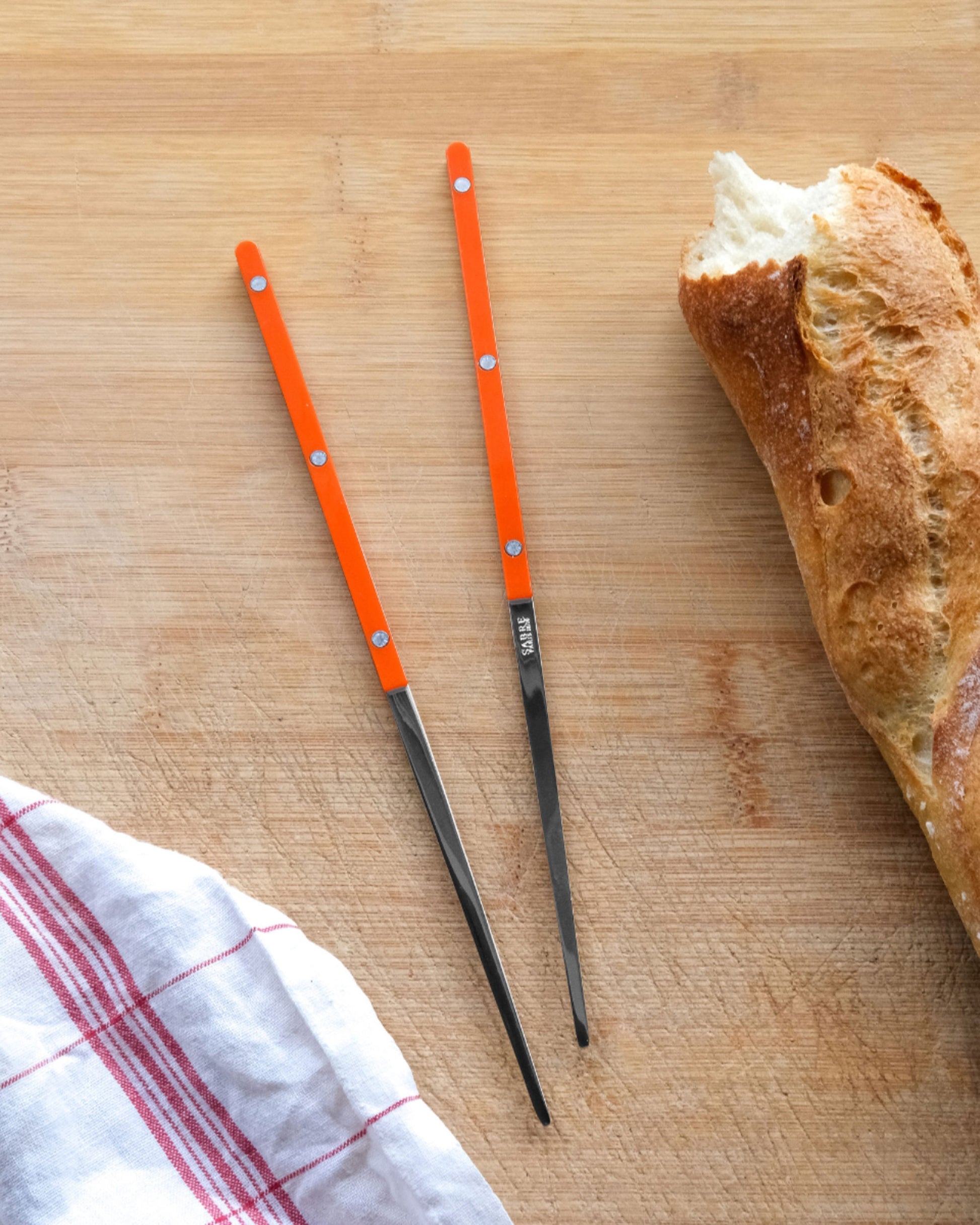 Styled image featuring the Sabre Paris Orange Chopsticks.