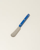 Sabre Paris Lapis Blue Butter Spreader on light color background.