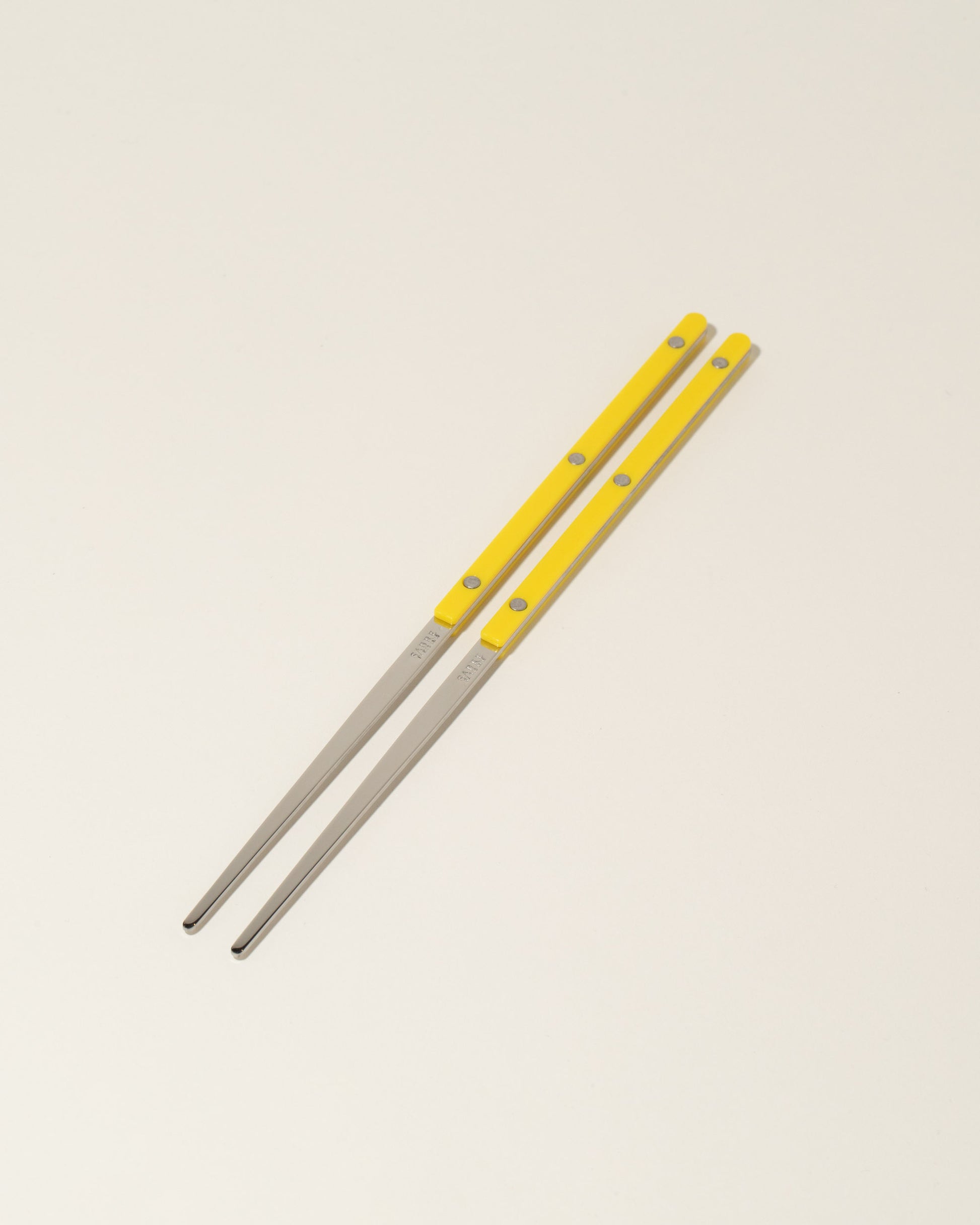 Sabre Paris Green Fern Chopsticks on light color background.