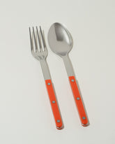 Sabre Paris Orange Serving Set on light color background.