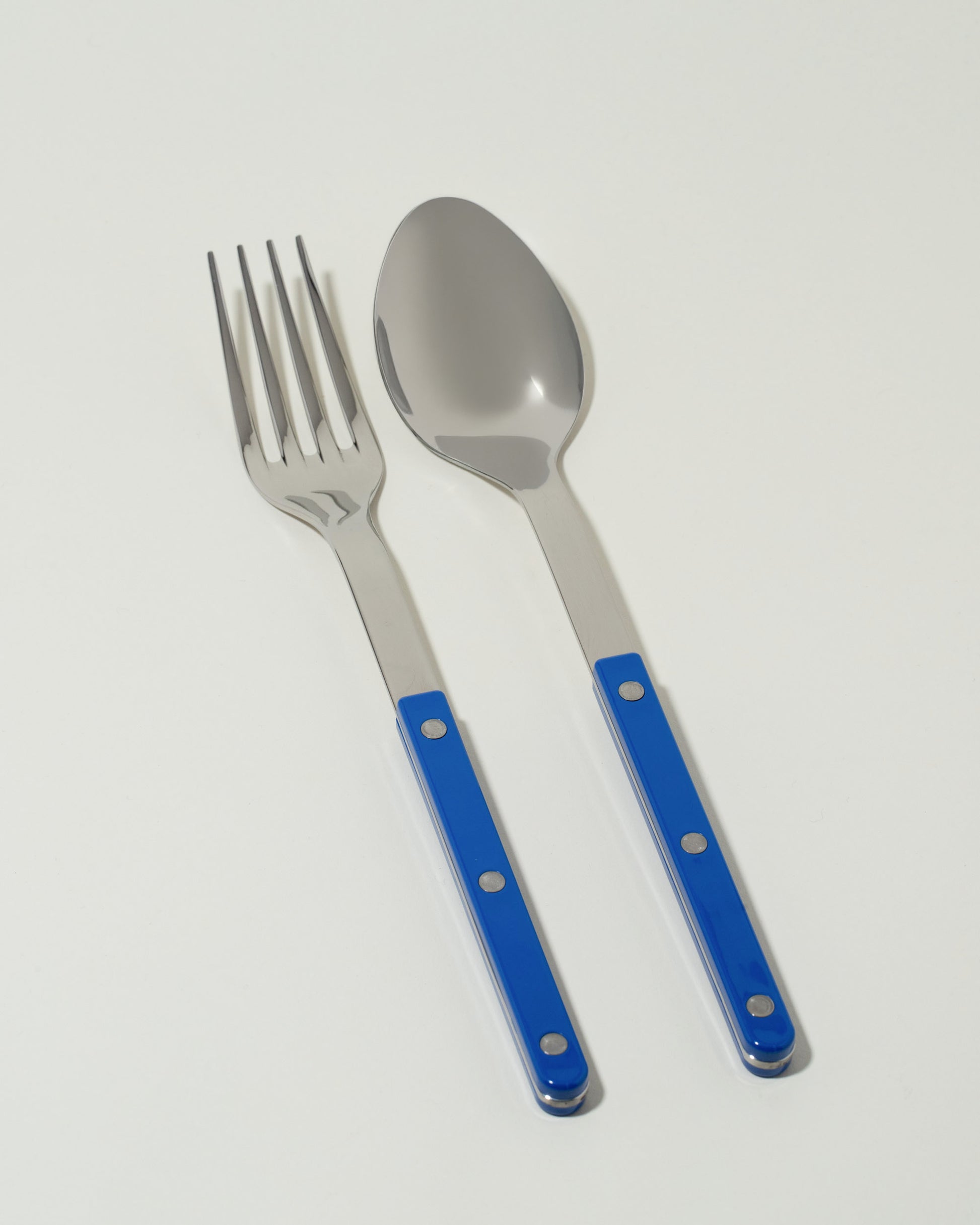 Sabre Paris Lapis Blue Serving Set on light color background.