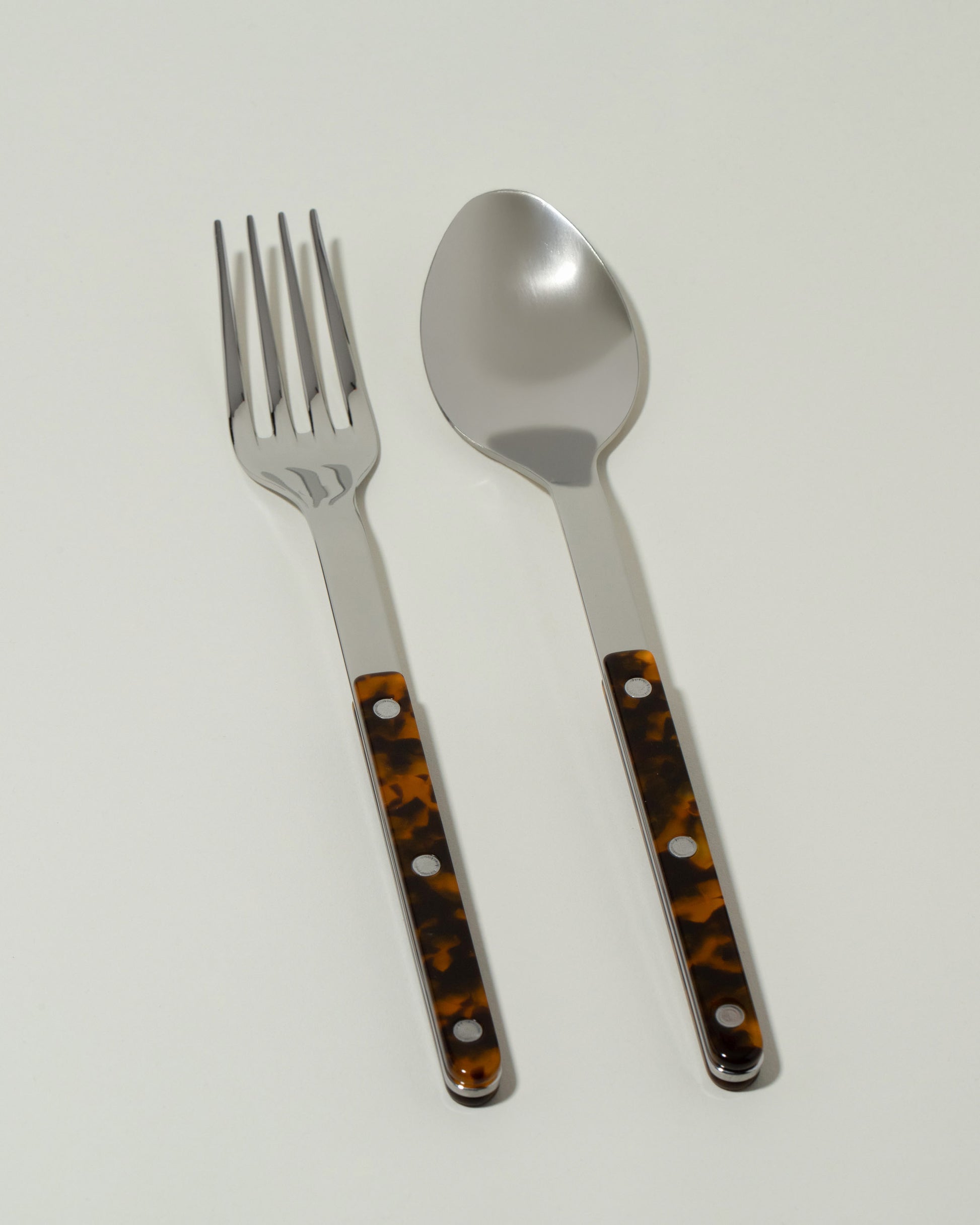 Sabre Paris Faux Tortoise Serving Set on light color background.