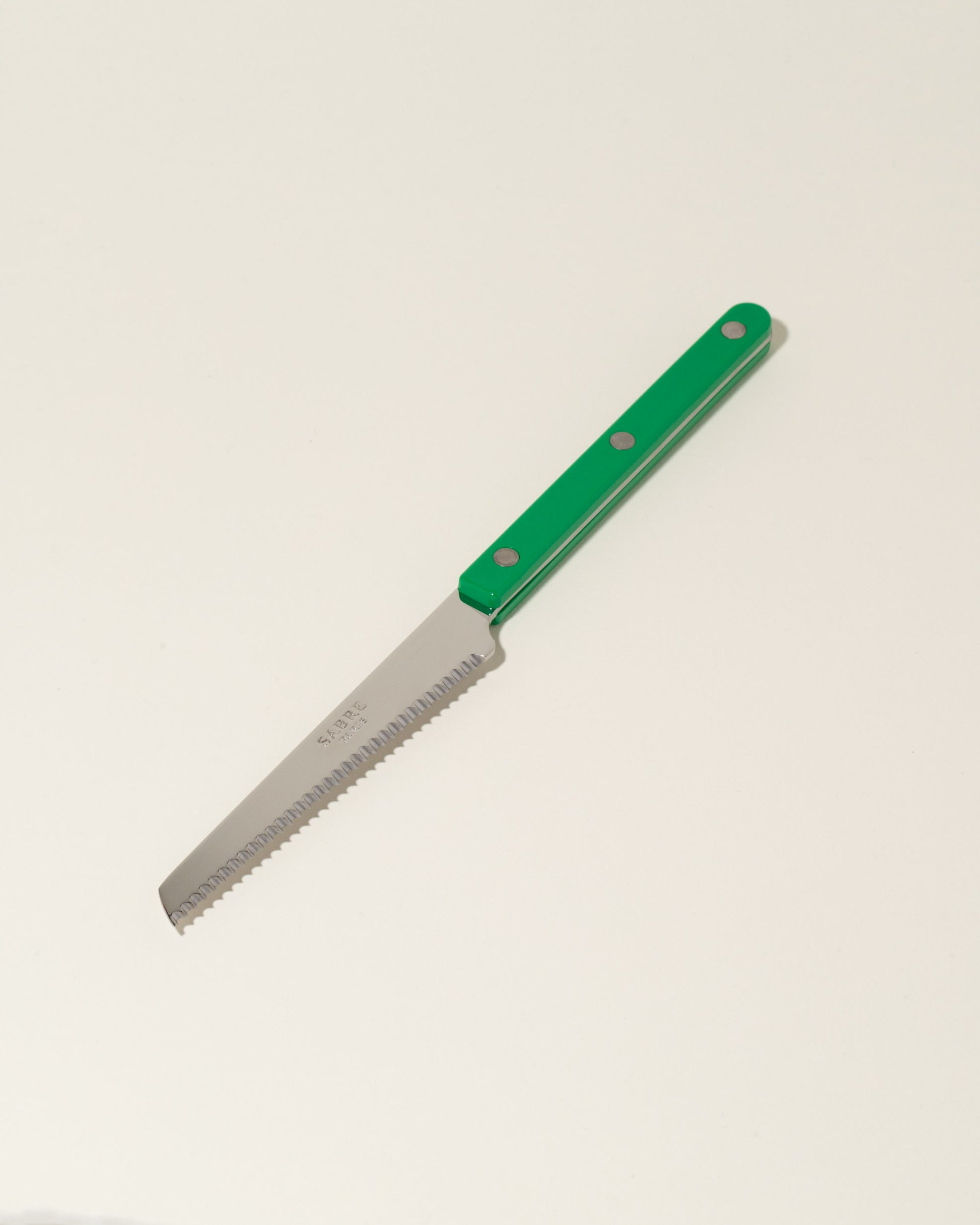 Sabre Paris Garden Green Tomato Knife on light color background.