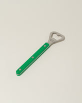 Sabre Paris Garden Green Bottle Opener on light color background.