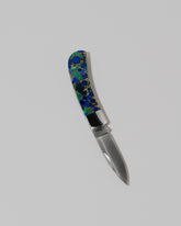 Santa Fe Stoneworks Azurite and Lapis Small Lockback Knife on light color background.