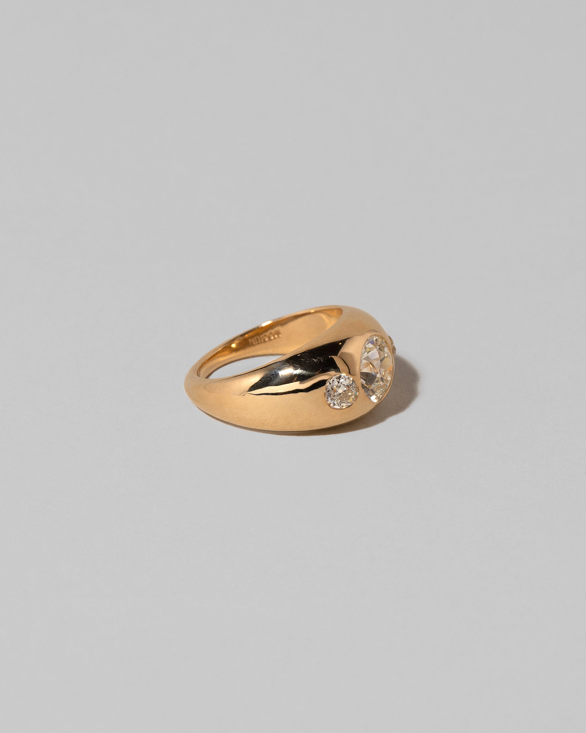 View from the back of the Diamond Saturn Ring on light color background.