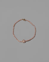 Delphin Pink Lagniappe Bracelet on light color background.