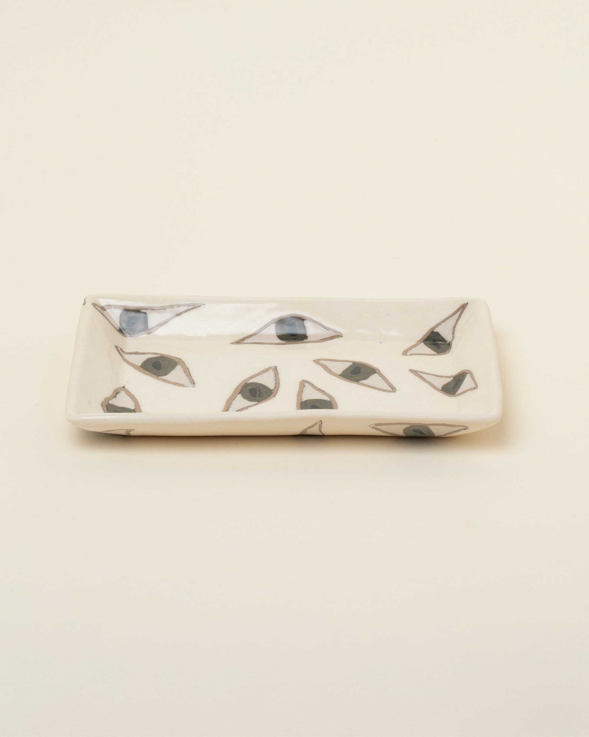 View from the side of the Slush Club Nerikomi Eye Tray on light color background.