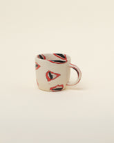 Slush Club Nerikomi Lip Mug on light color background.
