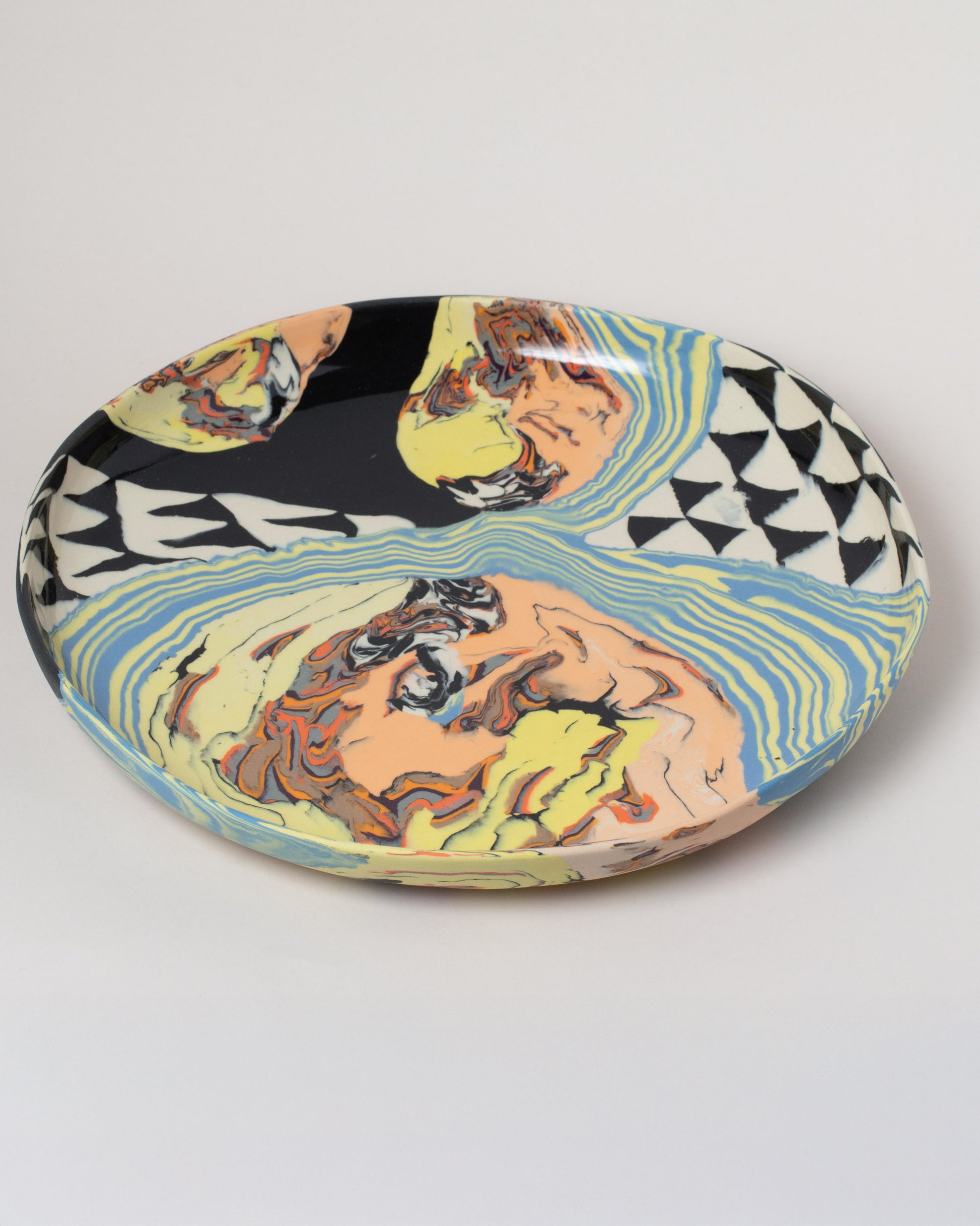 Closeup details of the Slush Club Nerikomi Platter No. 101 on light color background.