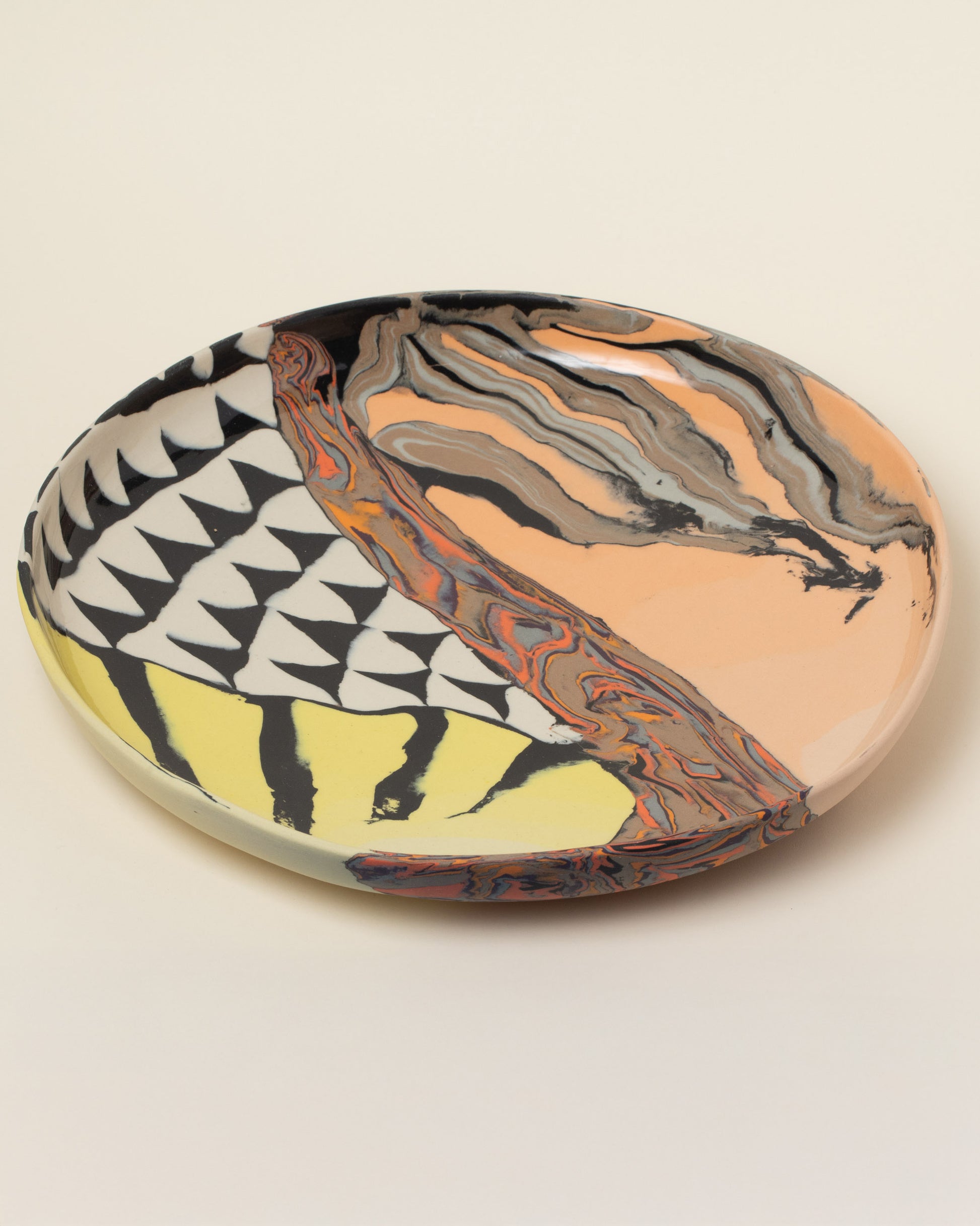 Closeup details of the Slush Club Nerikomi Platter No. 220 on light color background.