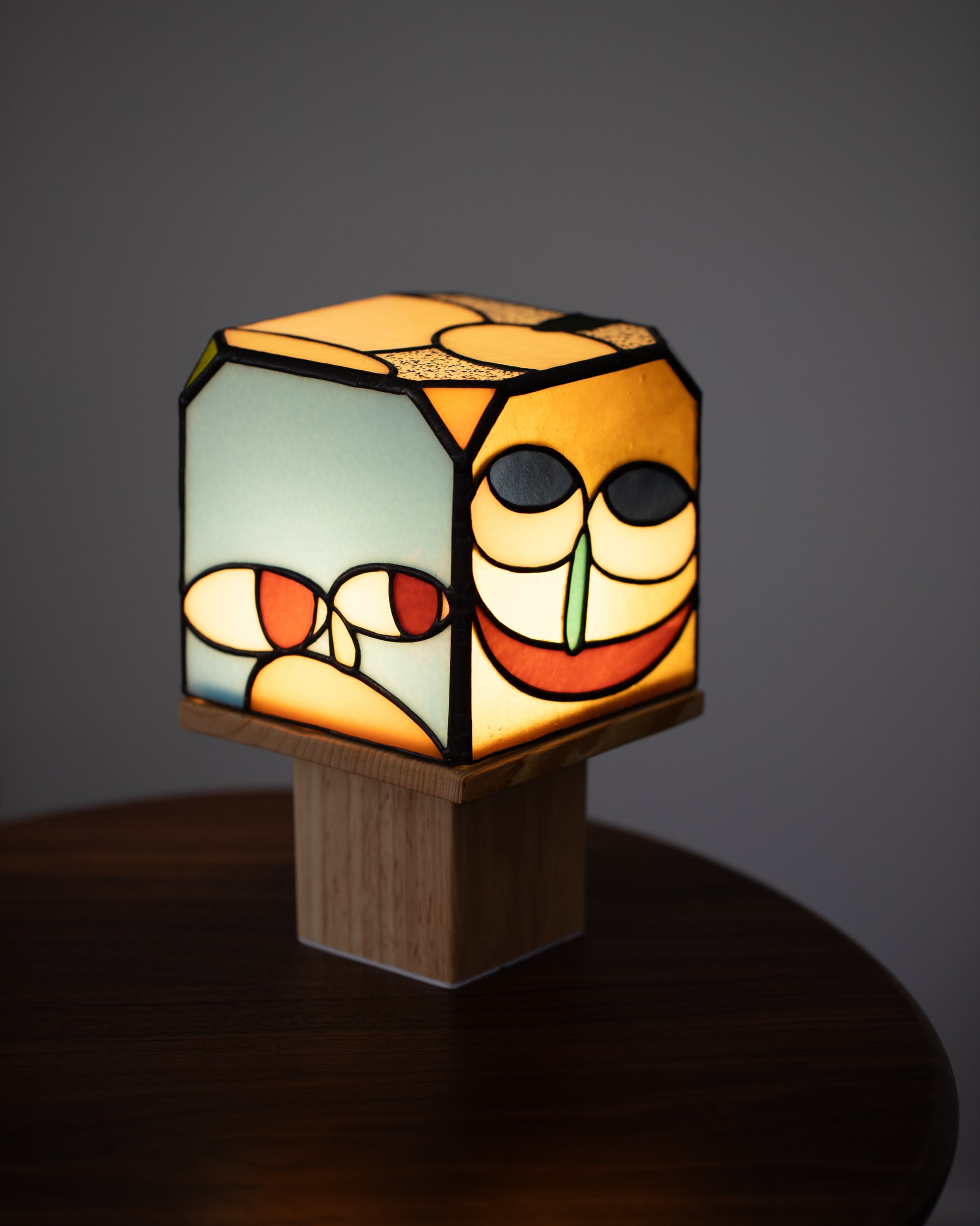 View from the back of the Soeun Lee Apotropaia Four Sides Lamp on light color background.