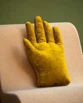 Styled image featuring the Sohn Left Chartreuse Chenille Soft Sculpture Hand Pillow.
