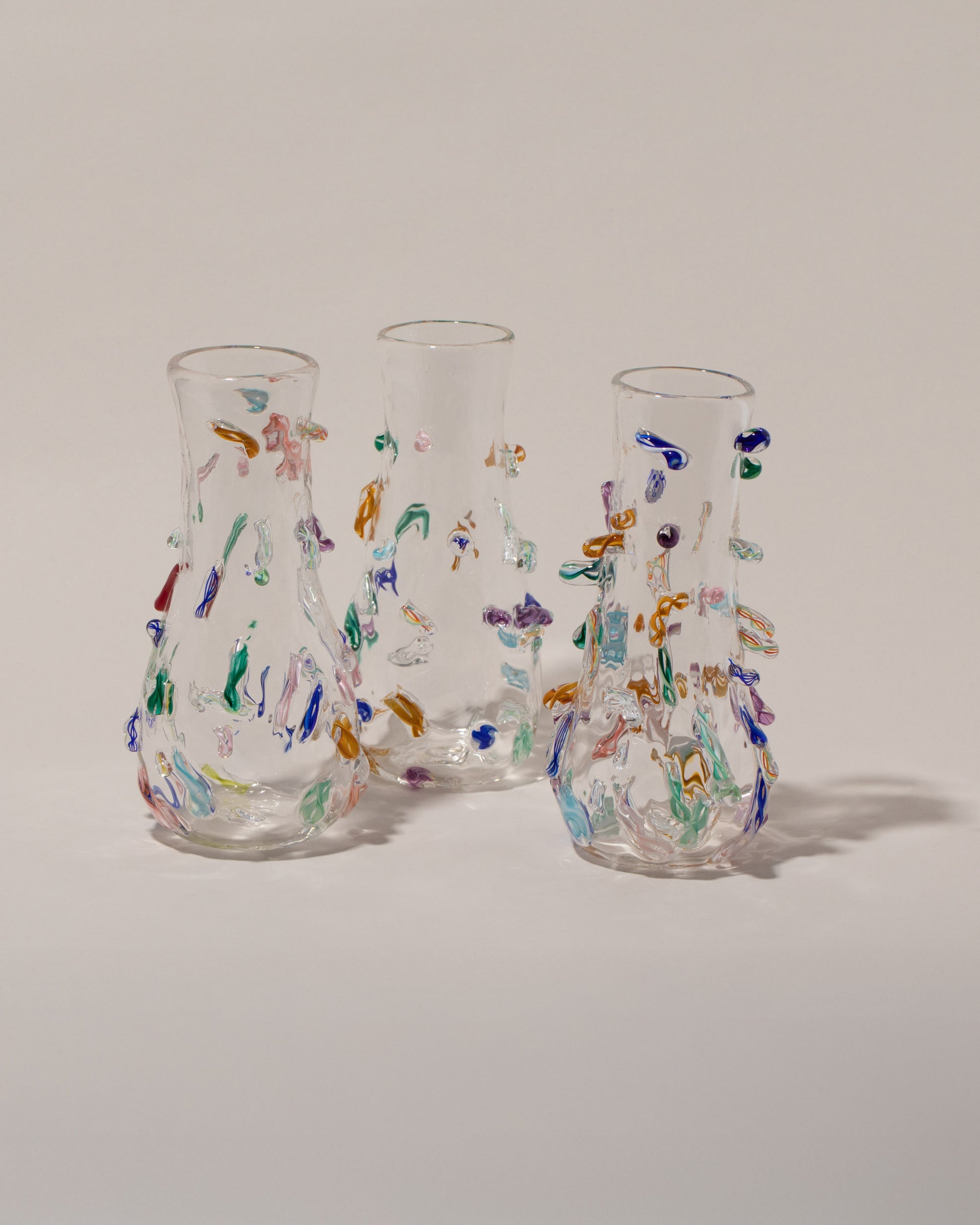 Stover Glass Petite Cane Vases on light color background.