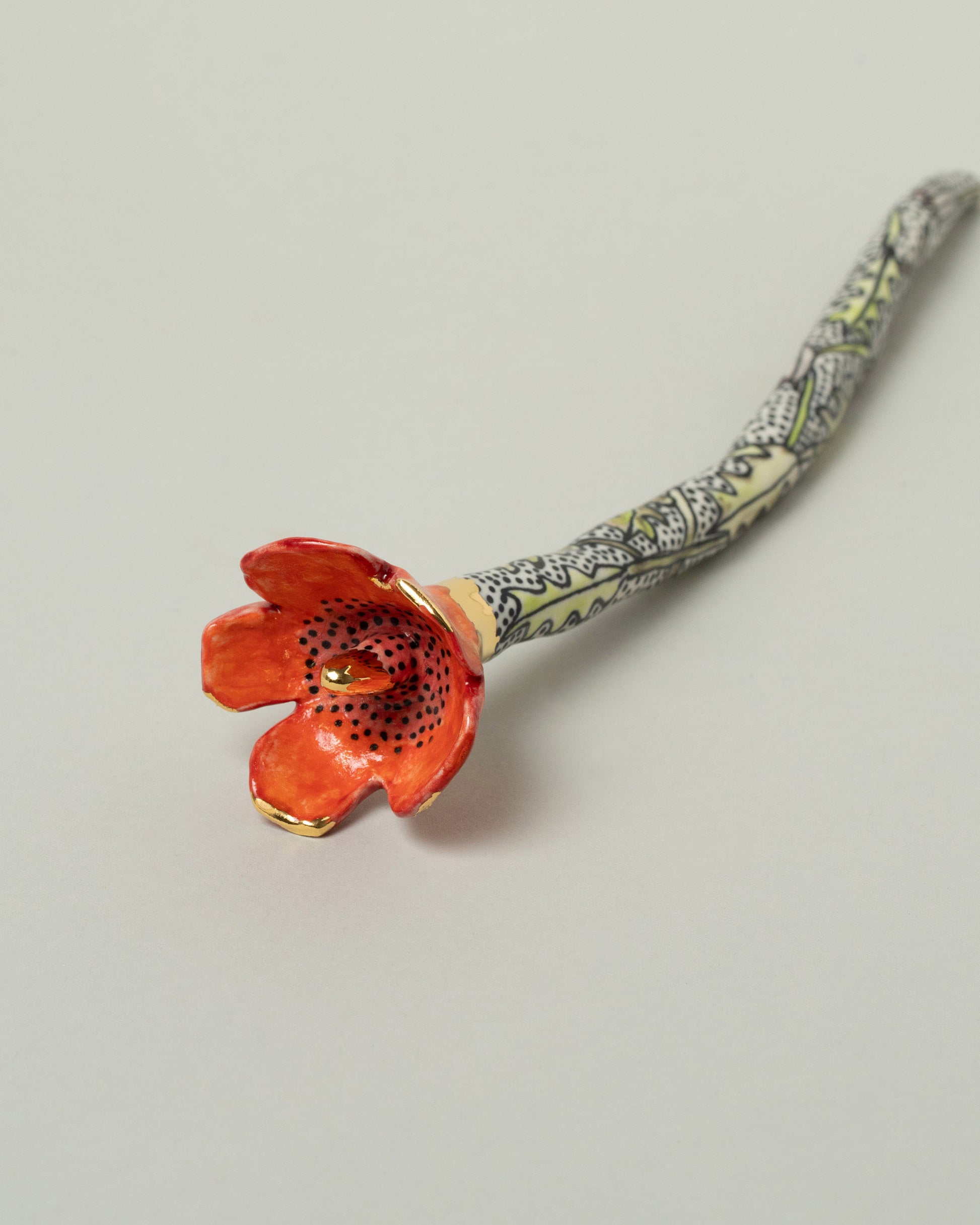 Closeup details of the Suzanne Sullivan For Your Pleasure Poppy Flower on light color background.