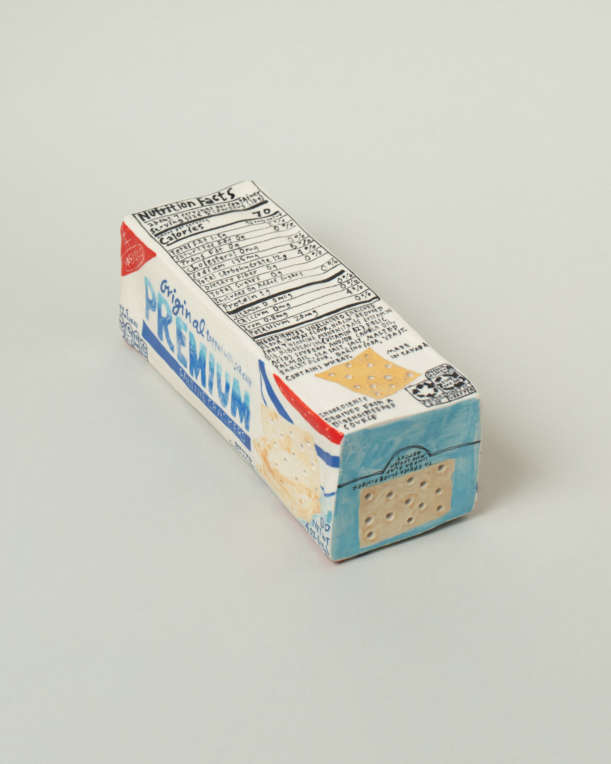 View from the back of the Suzanne Sullivan For Your Pleasure Saltine Box on light color background.
