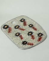 Suzanne Sullivan One Board on light color background.