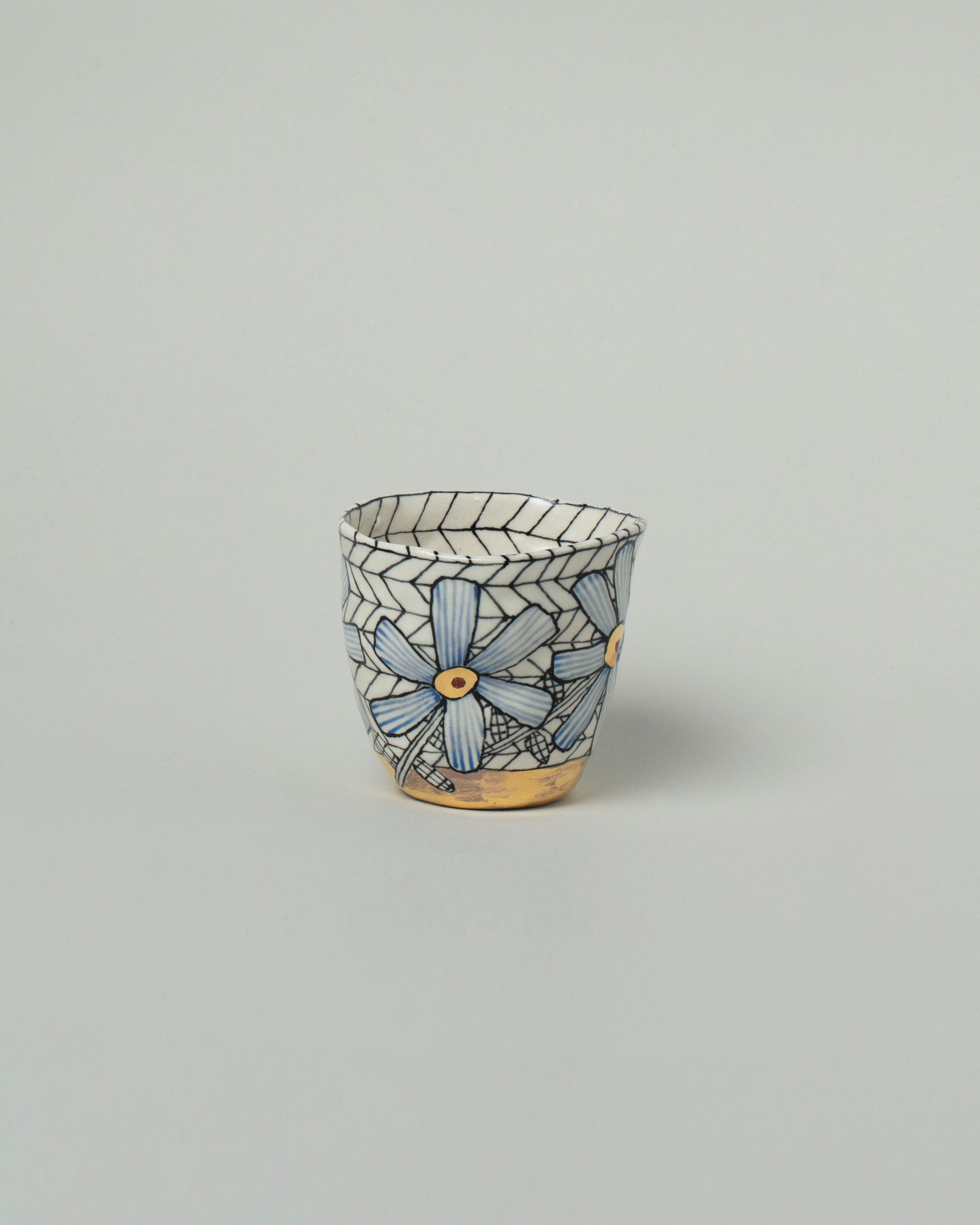 Suzanne Sullivan One Pasture Tumbler on light color background.