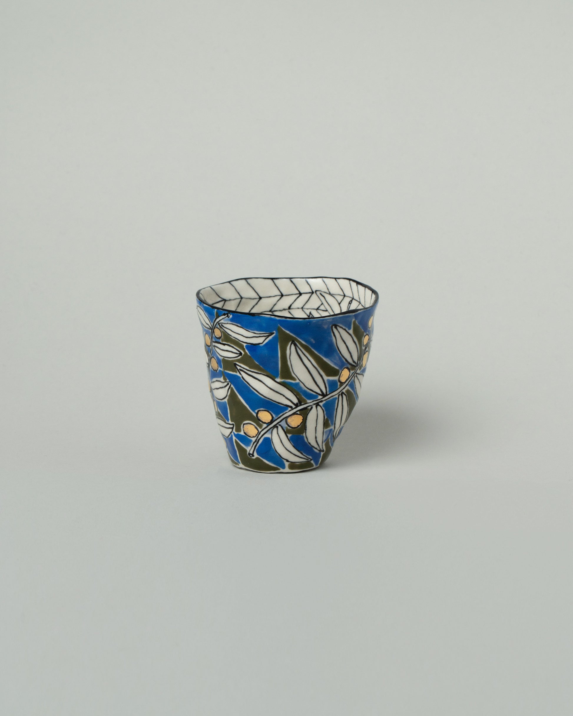 Suzanne Sullivan Three Pasture Tumbler on light color background.