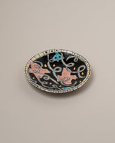 Suzanne Sullivan One And Lost No Time Small Plate on light color background.