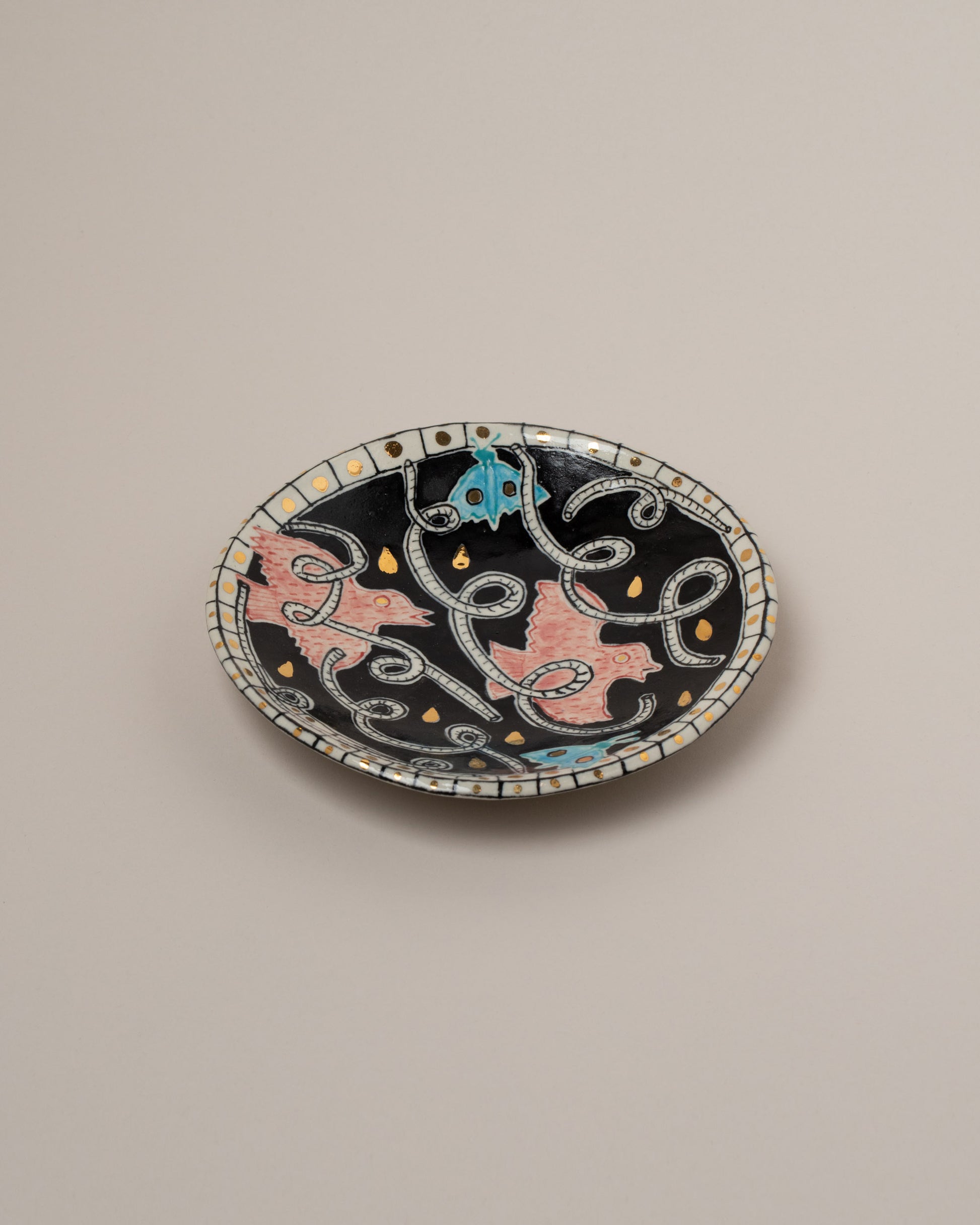 Suzanne Sullivan One And Lost No Time Small Plate on light color background.