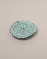 Suzanne Sullivan Two And Lost No Time Small Plate on light color background.