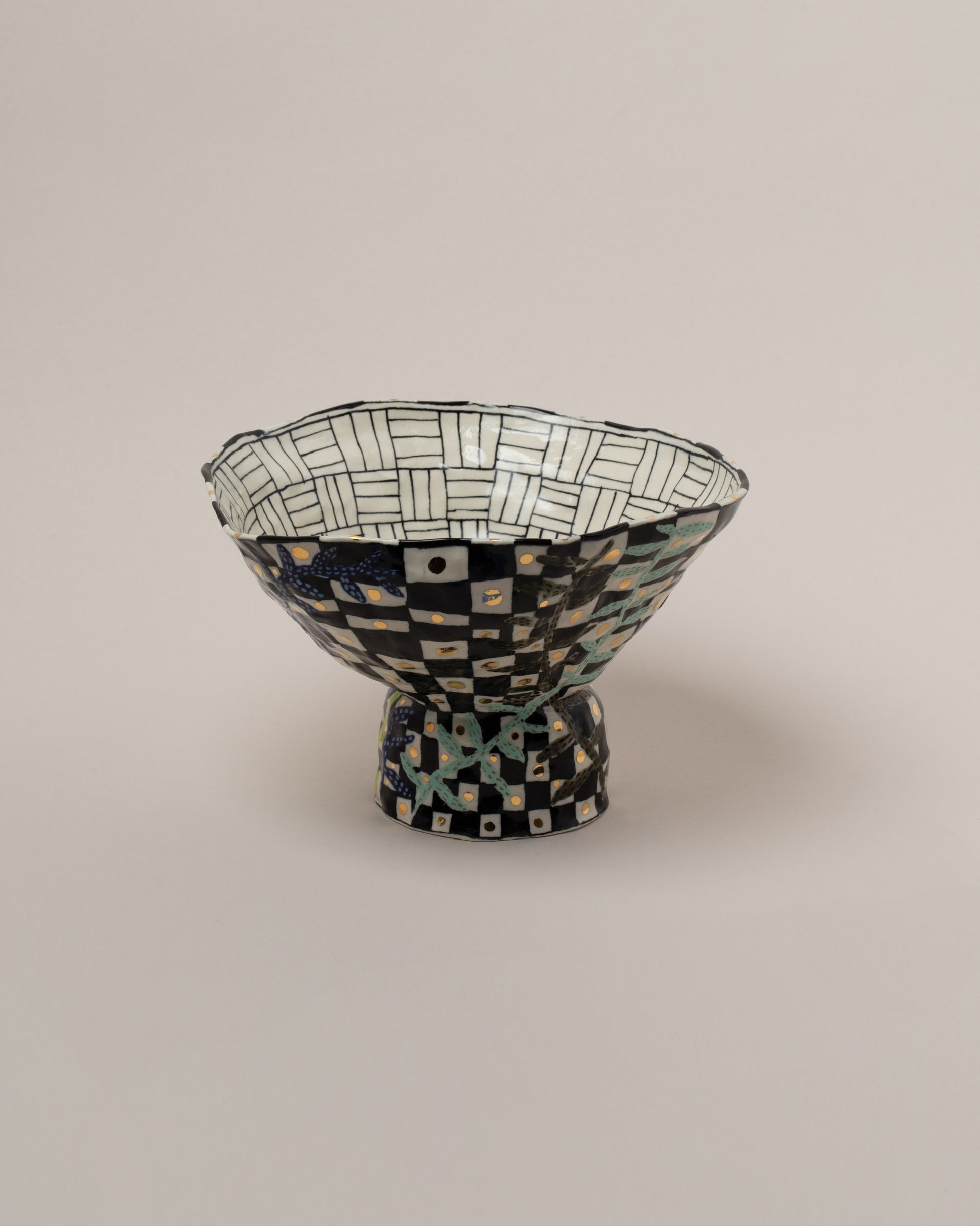 Suzanne Sullivan Answers To Questions Footed Bowl on light color background.