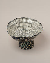 Closeup details of the Suzanne Sullivan Answers To Questions Footed Bowl on light color background.