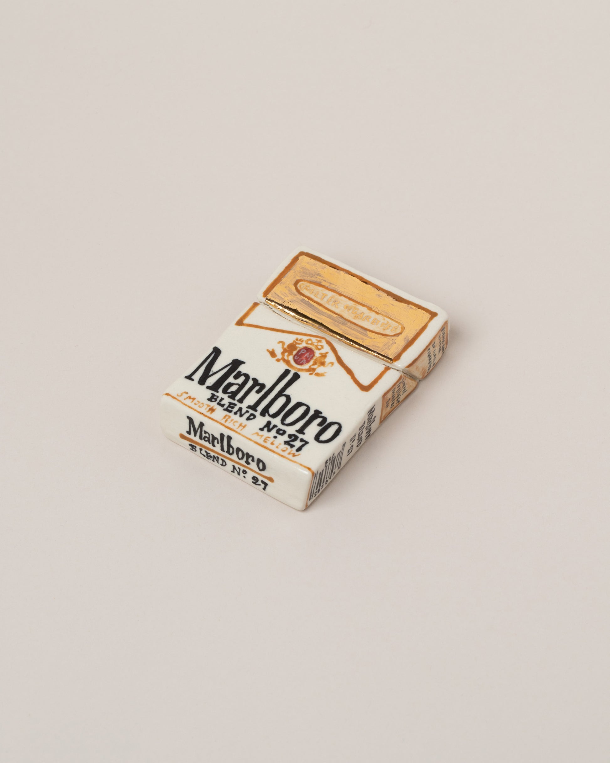 Suzanne Sullivan Marlboro Cigarettes on light color background.