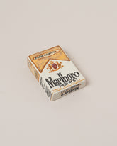 Closeup details of the Suzanne Sullivan Marlboro Cigarettes on light color background.