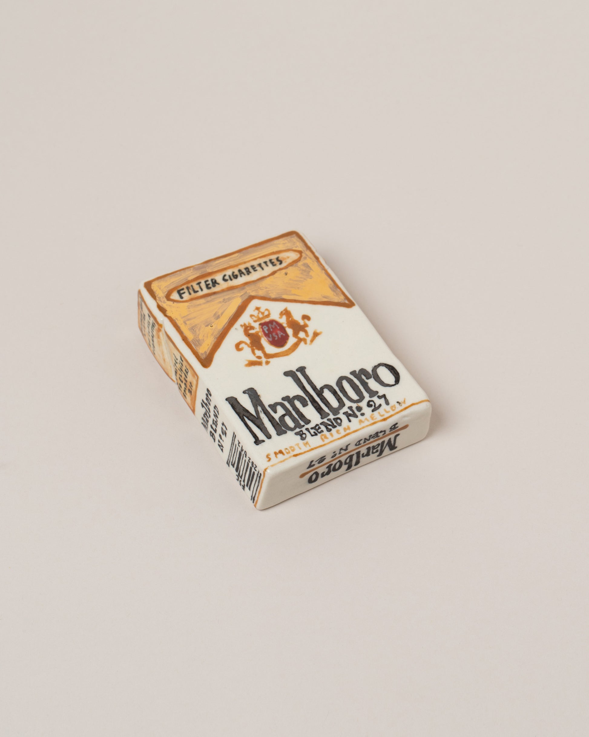 Closeup details of the Suzanne Sullivan Marlboro Cigarettes on light color background.