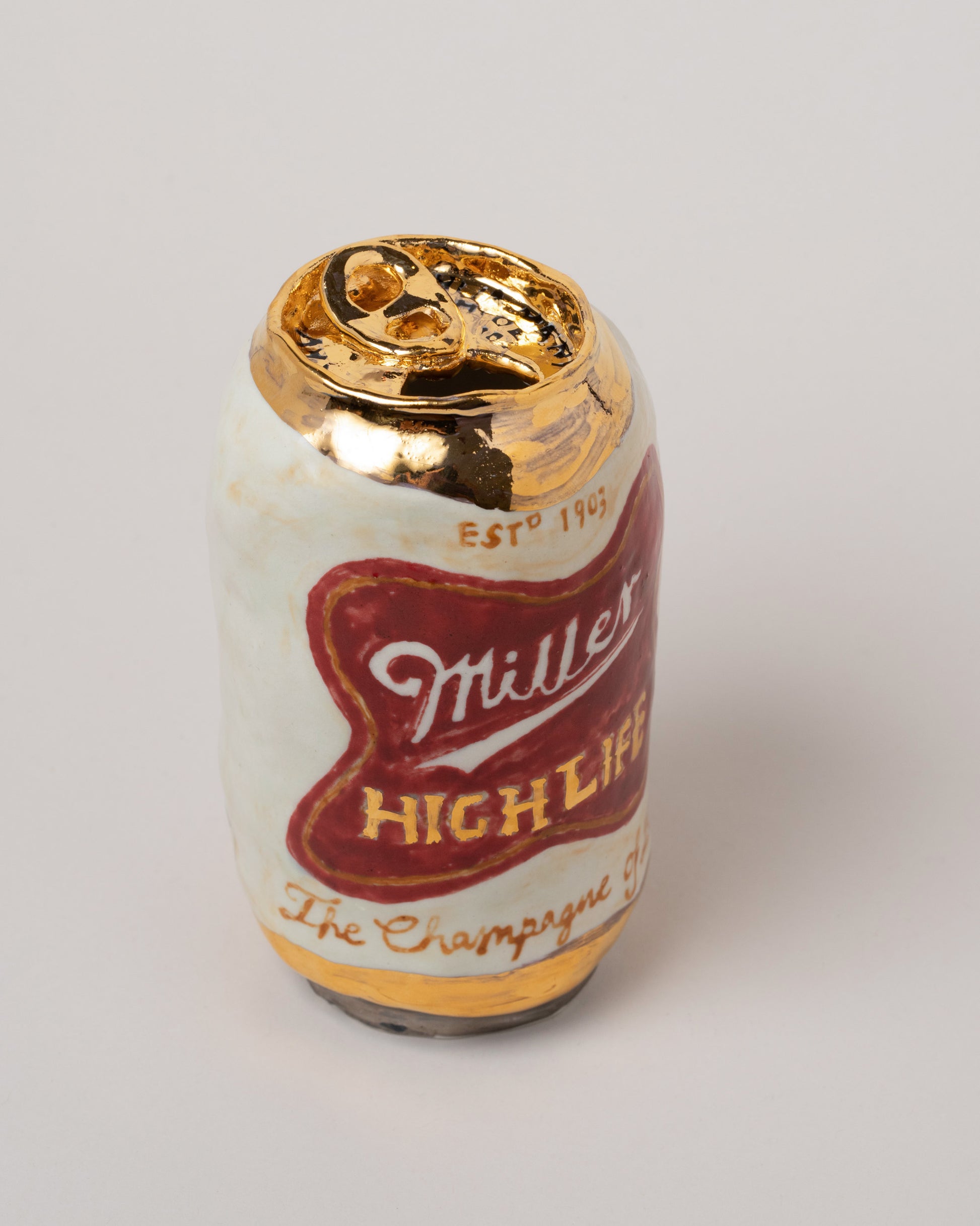 Closeup details of the Suzanne Sullivan Miller Beer on light color background.