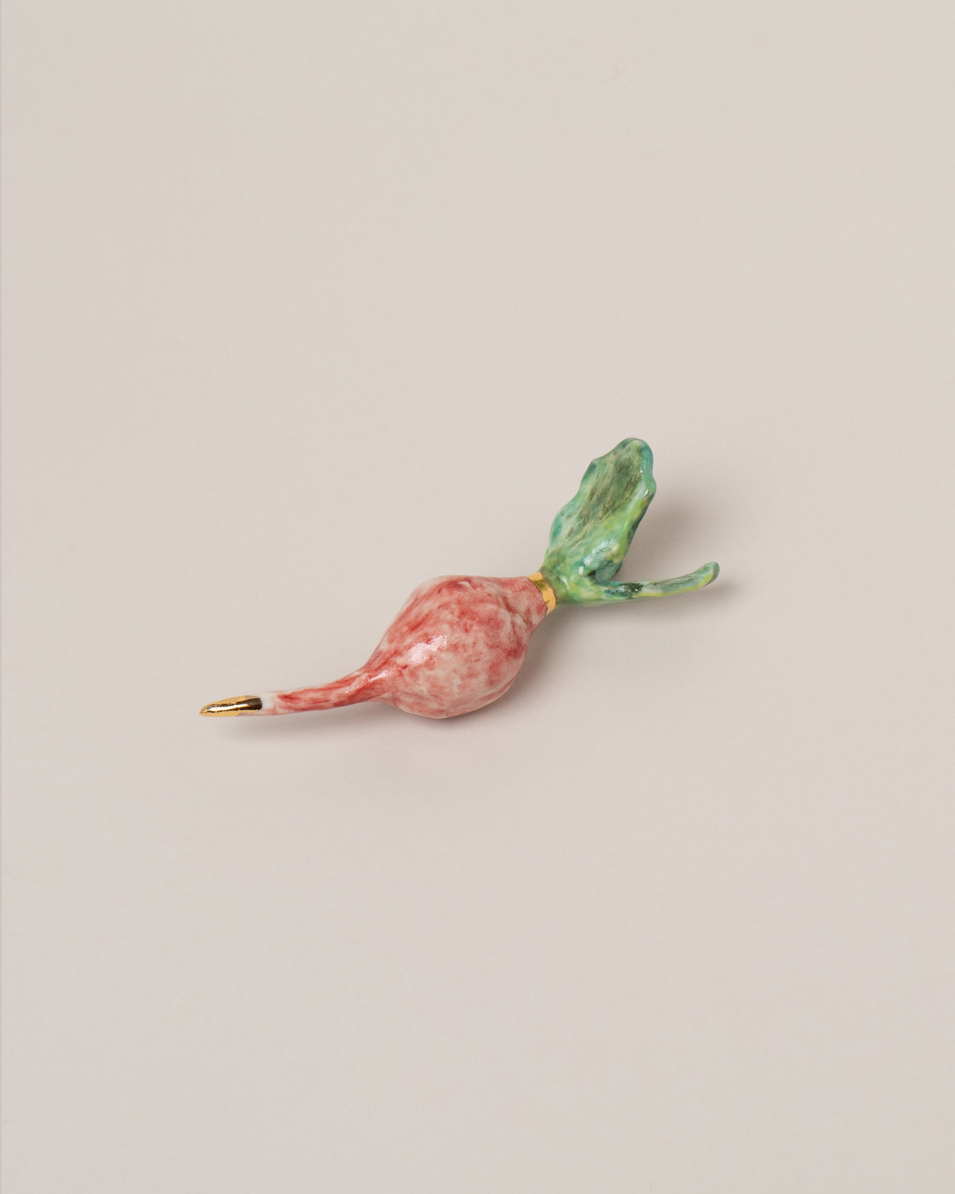 Suzanne Sullivan Radish on light color background.