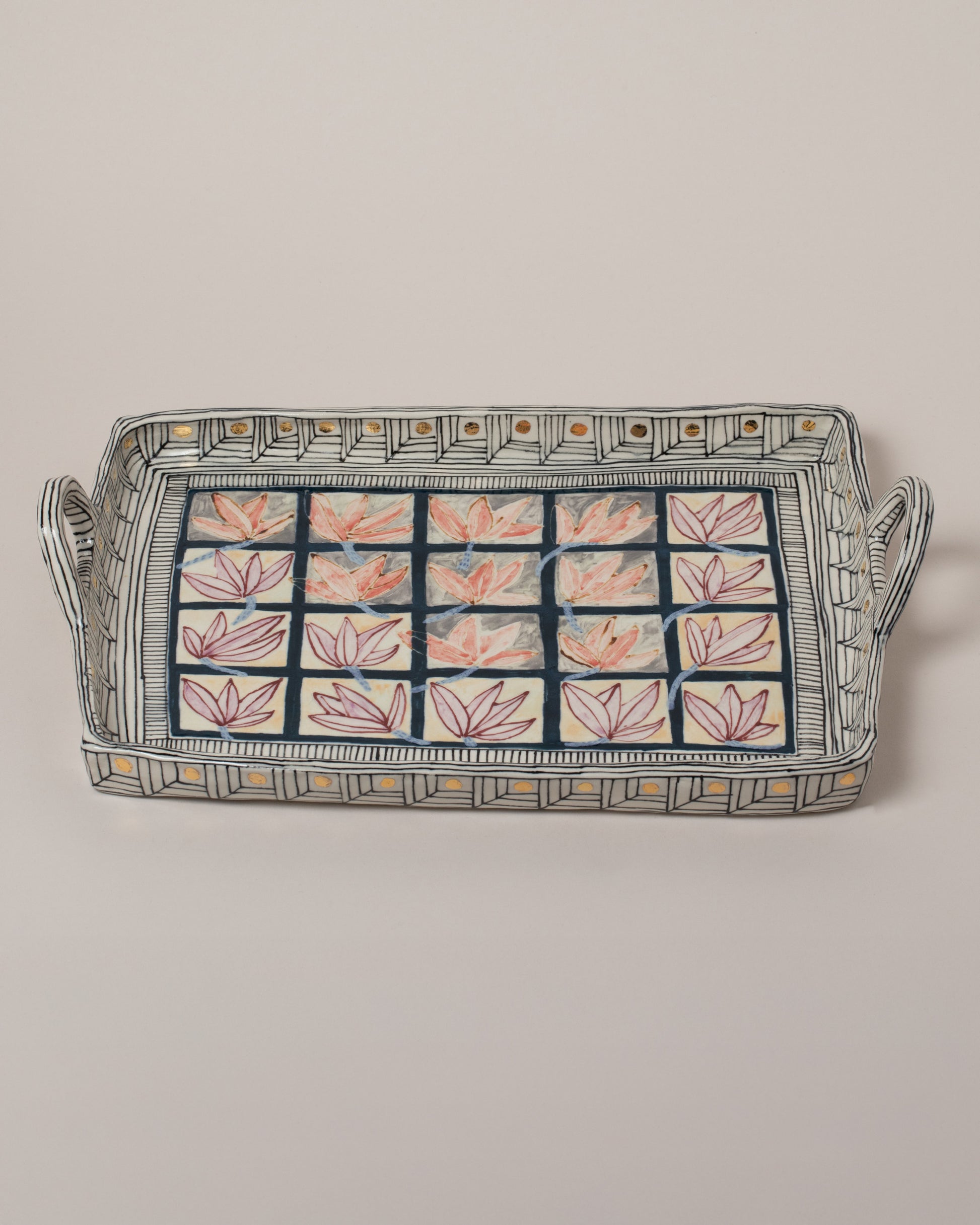 Closeup details of the Suzanne Sullivan Reminder Of Our Pilgrimage Tray on light color background.