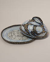 Detail view of the Suzanne Sullivan One Accidental Companionship Butter Dish on light color background.