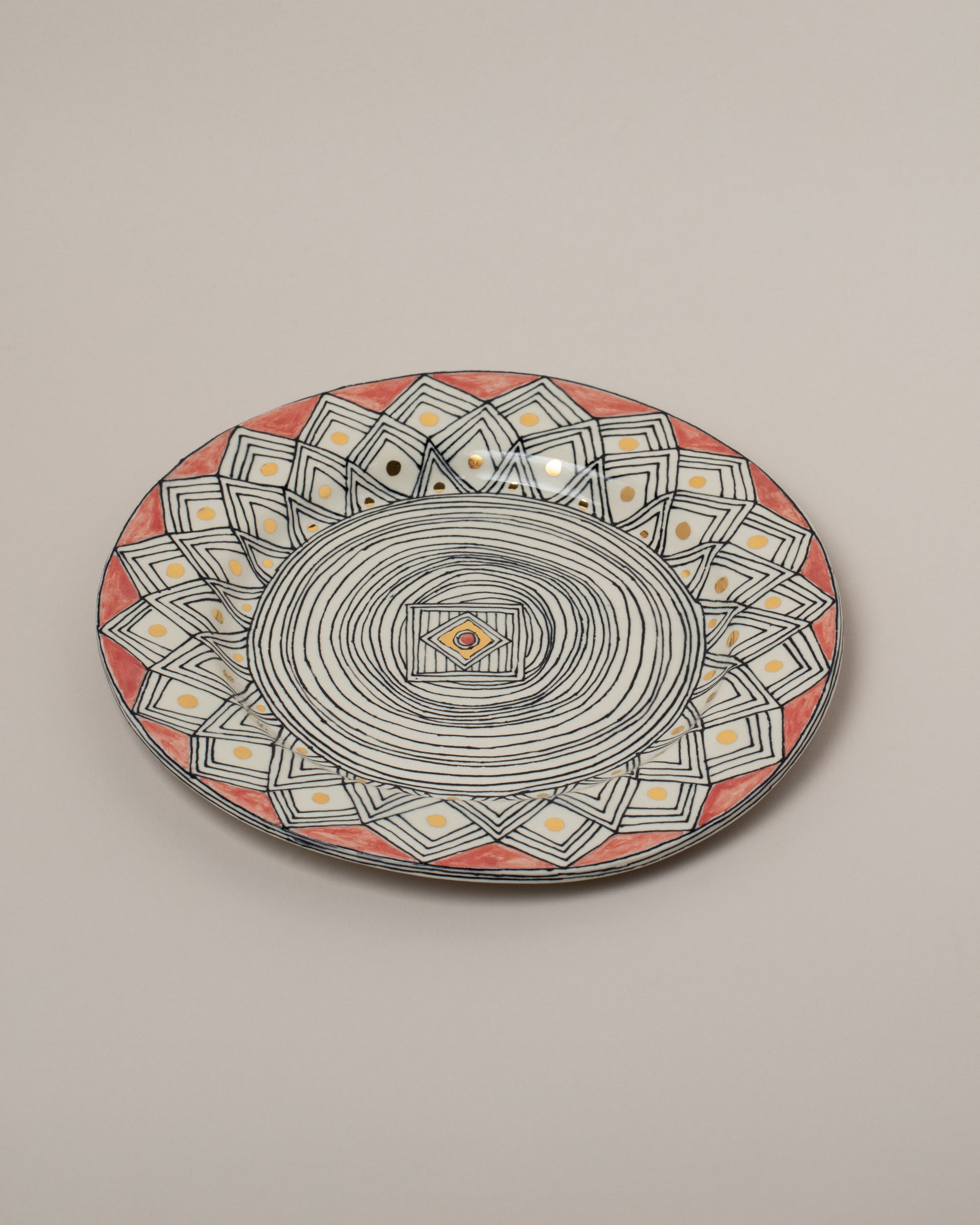 Suzanne Sullivan Three Fell Into A Trance Plate on light color background.