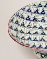 Closeup details of the Closeup details of the Suzanne Sullivan For To Be Sure and It's An Uncertain World Shallow Footed Bowls on light color background.