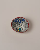 Suzanne Sullivan Four Full Of Deepest Meaning Small Bowl on light color background.