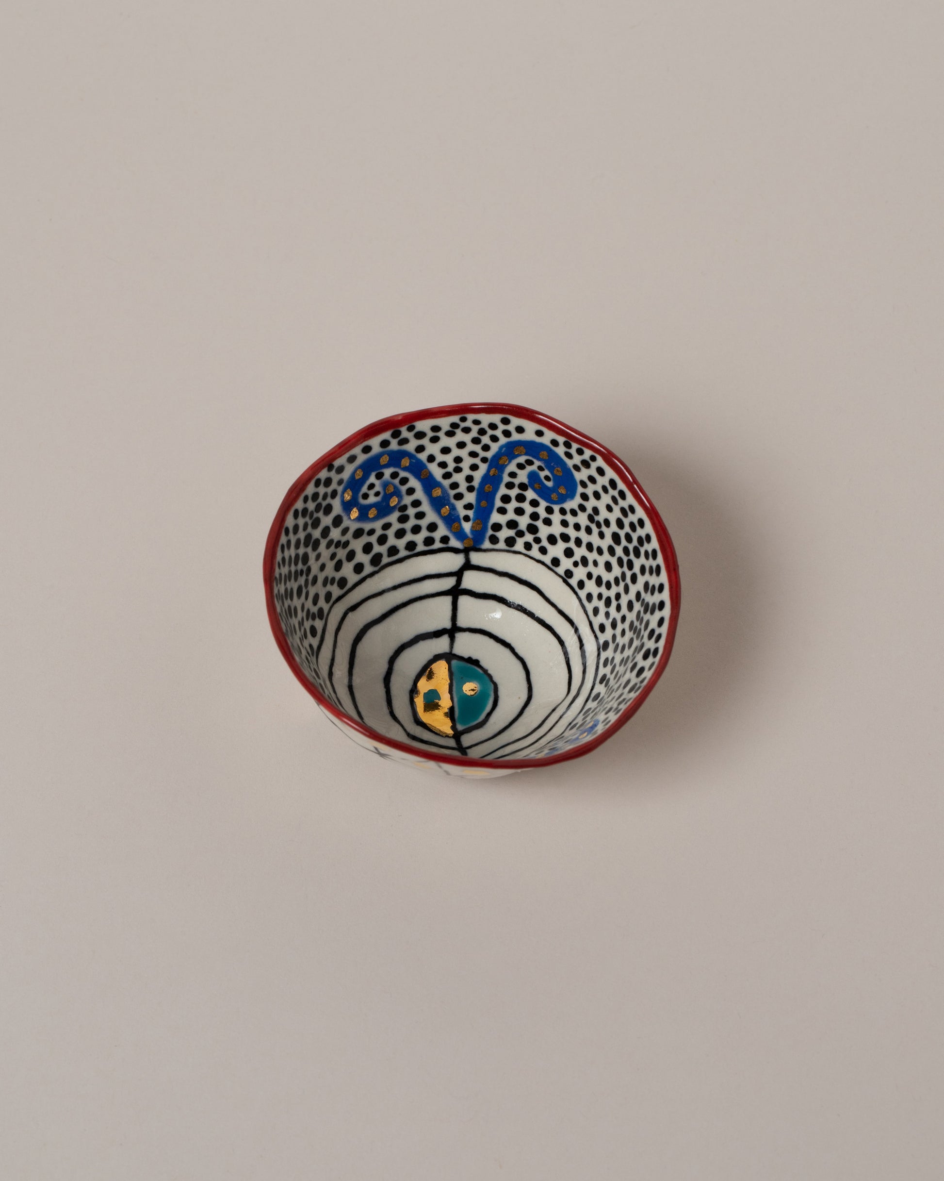 Suzanne Sullivan Four Full Of Deepest Meaning Small Bowl on light color background.