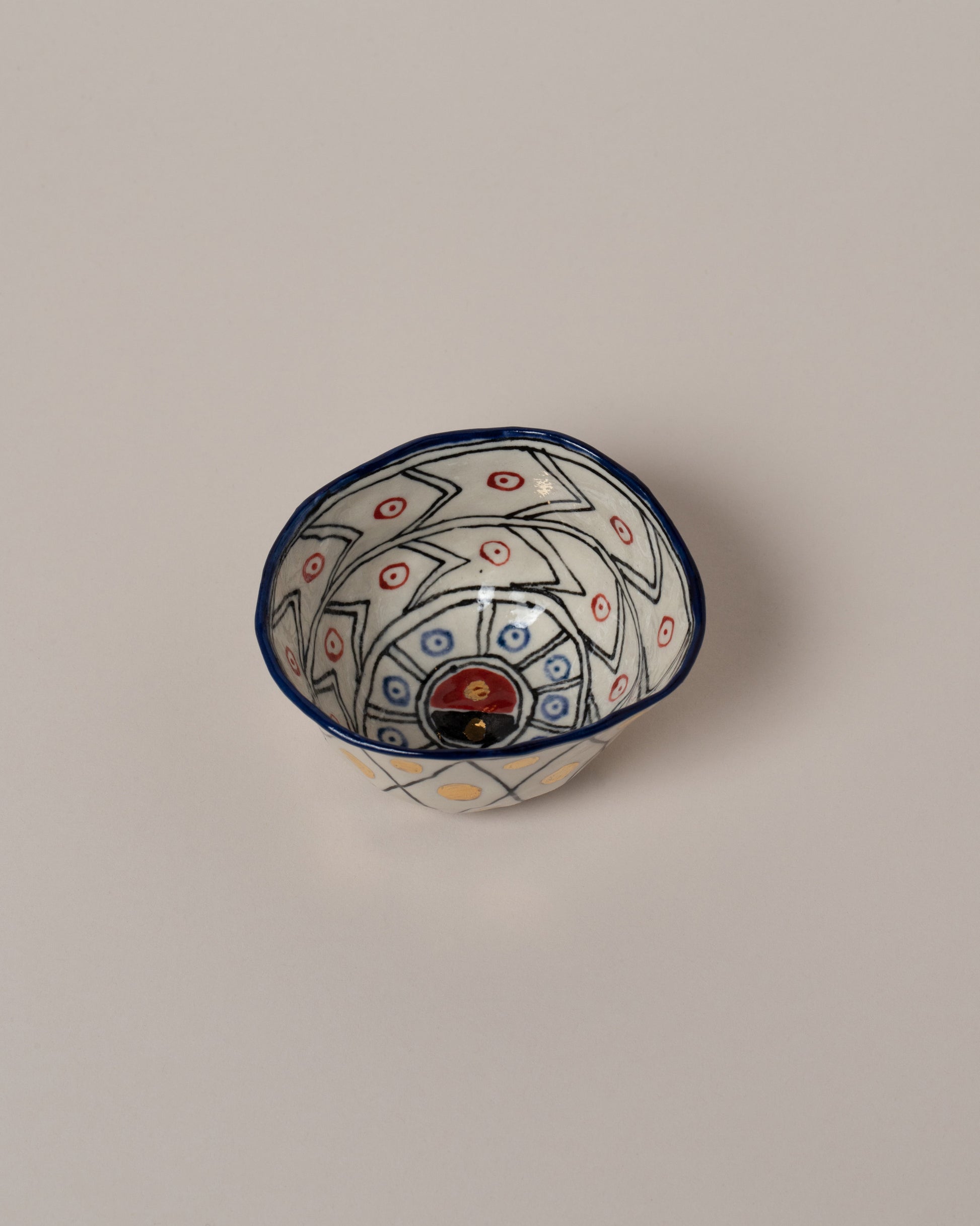 Suzanne Sullivan Five Full Of Deepest Meaning Small Bowl on light color background.