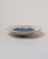 Suzanne Sullivan High Living And Honesty Footed Bowl on light color background.