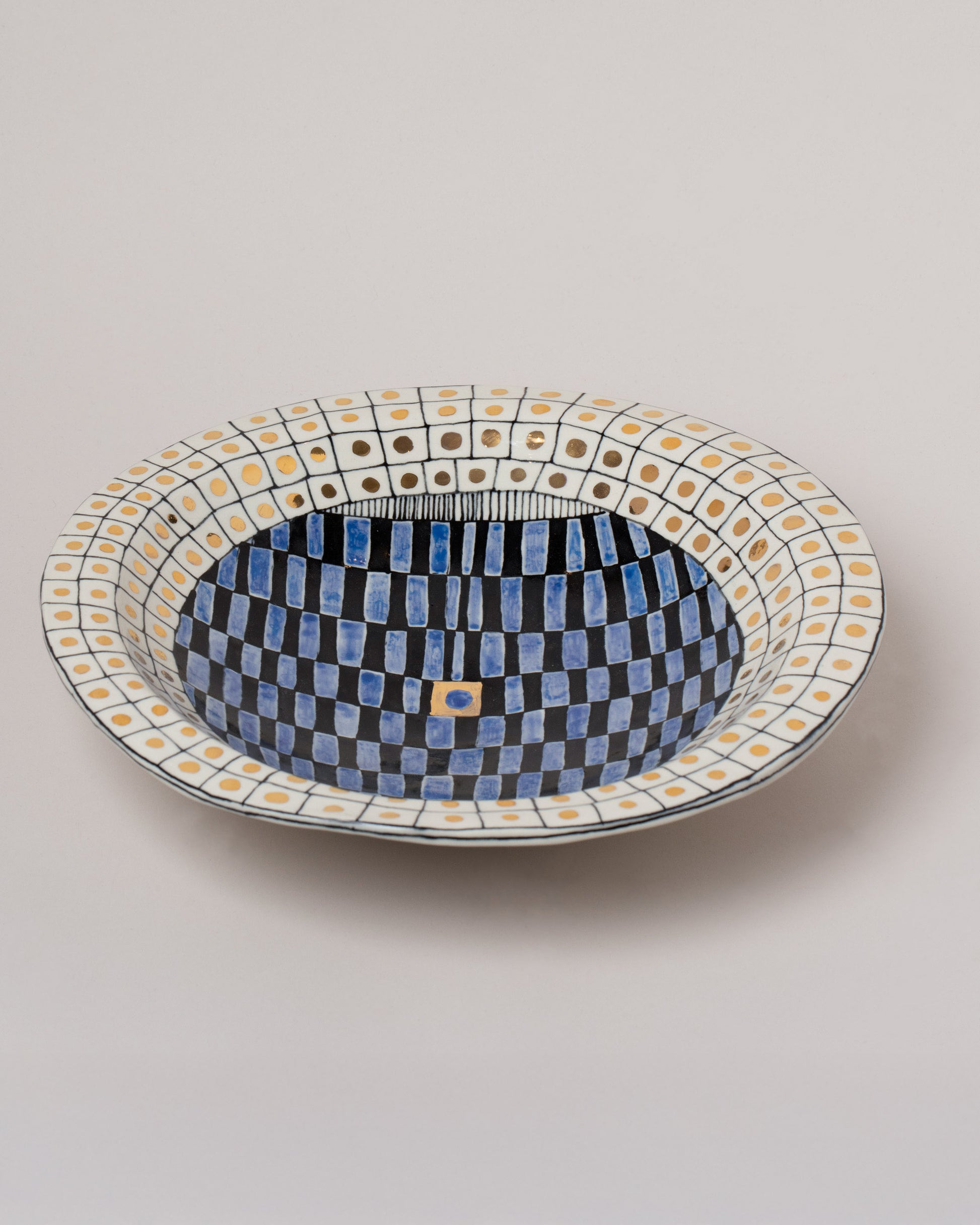 Closeup details of the Suzanne Sullivan High Living And Honesty Footed Bowl on light color background.