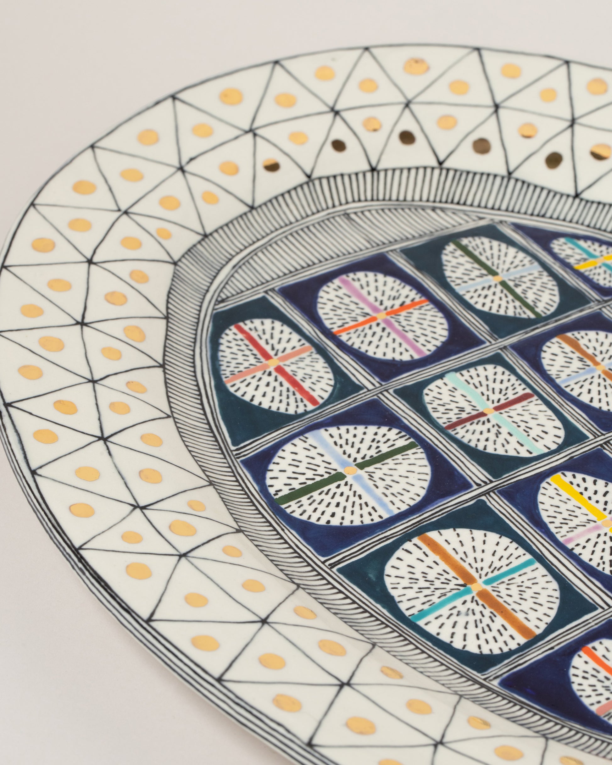 Closeup details of the Suzanne Sullivan Liberal Instrument Of Largesse Platter on light color background.