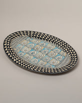 Suzanne Sullivan Rigged Out Stylishly Oval Platter on light color background.