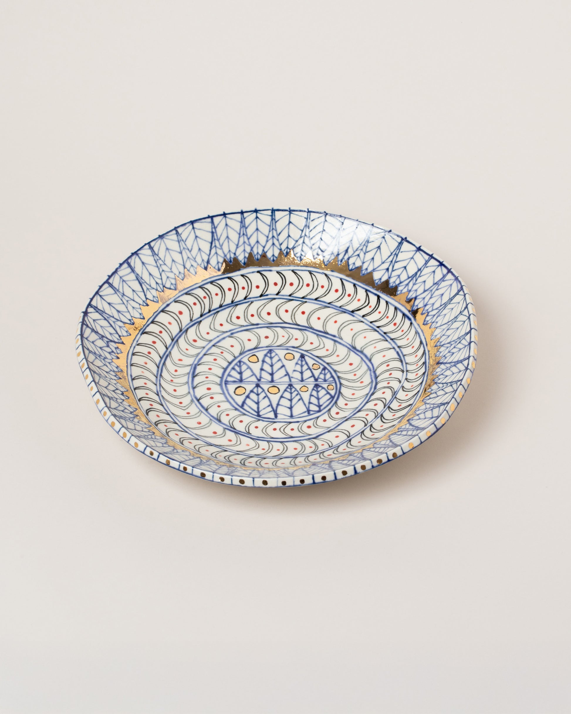 Inside view of the Suzanne Sullivan Five Saintly & Virtuous Pasta Bowl on light color background.