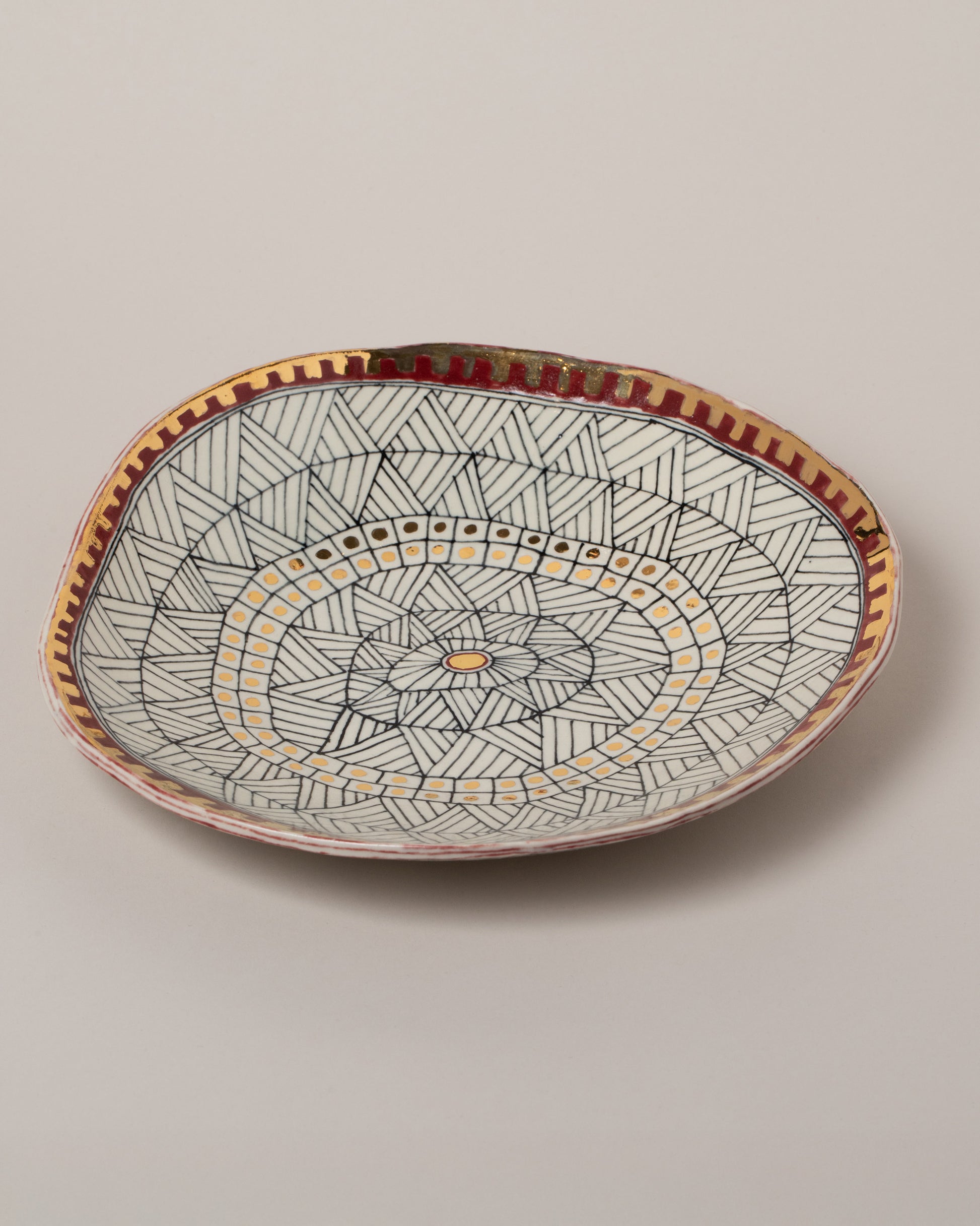 Closeup details of the Suzanne Sullivan Six Saintly & Virtuous Pasta Bowl on light color background.