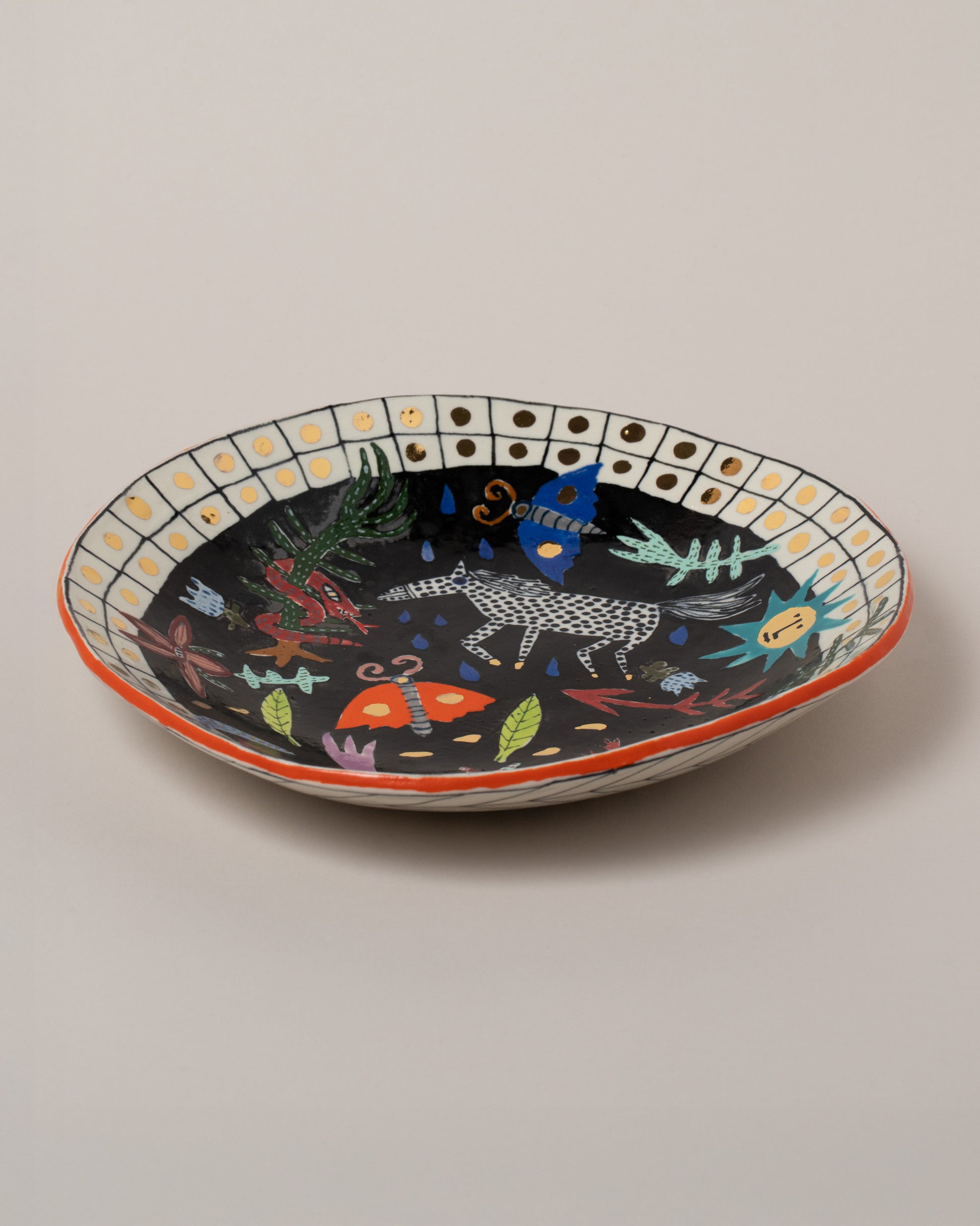 Suzanne Sullivan Seven Saintly & Virtuous Pasta Bowl on light color background.